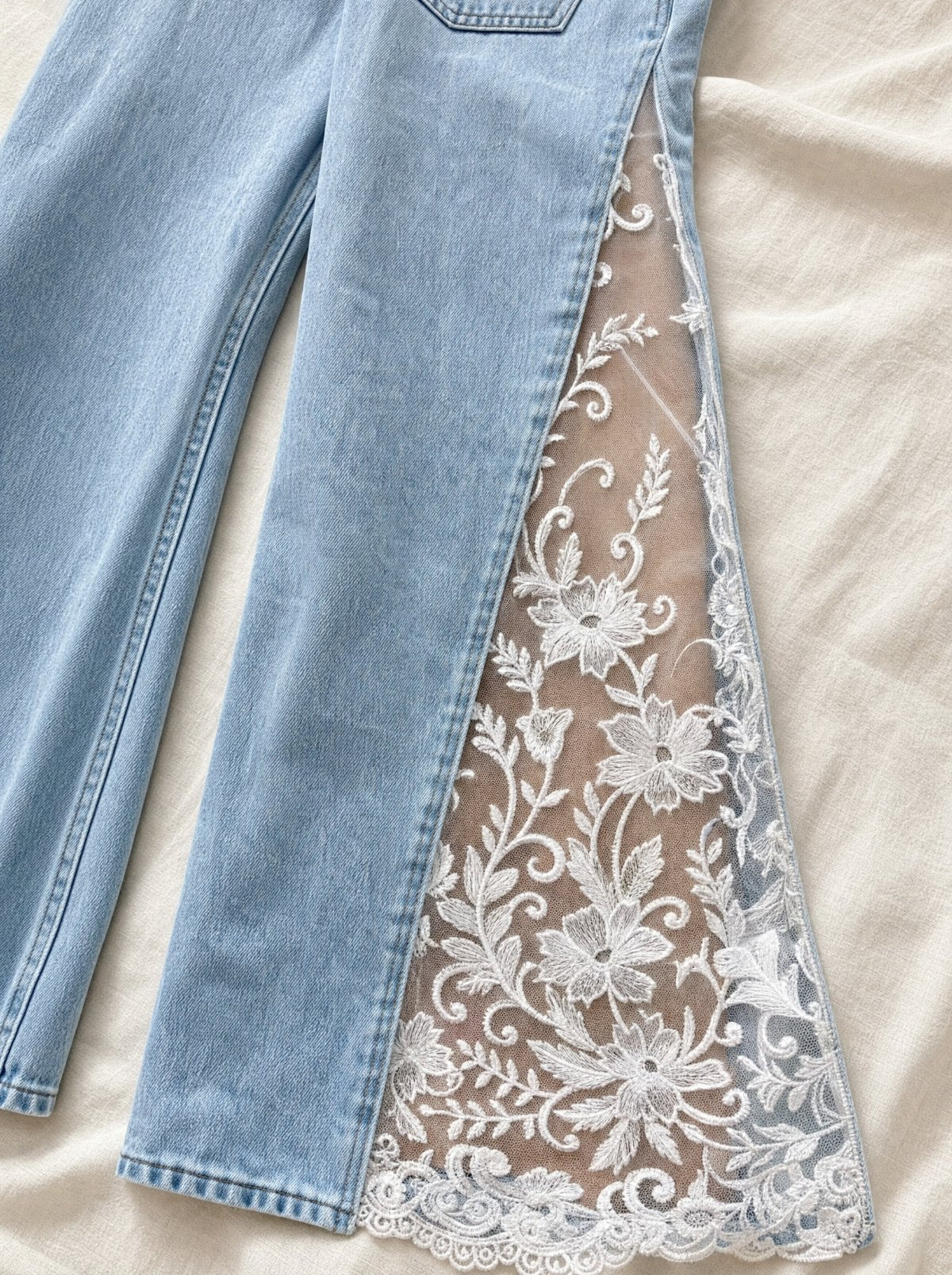 Close-up of the sheer floral lace side slit